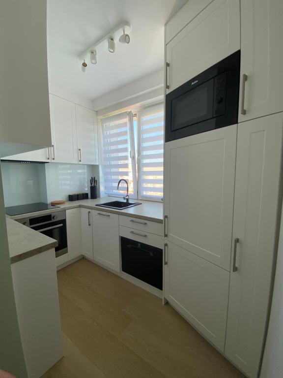 Kuchyňa alebo kuchynka v ubytovaní Apartament Długie Ogrody