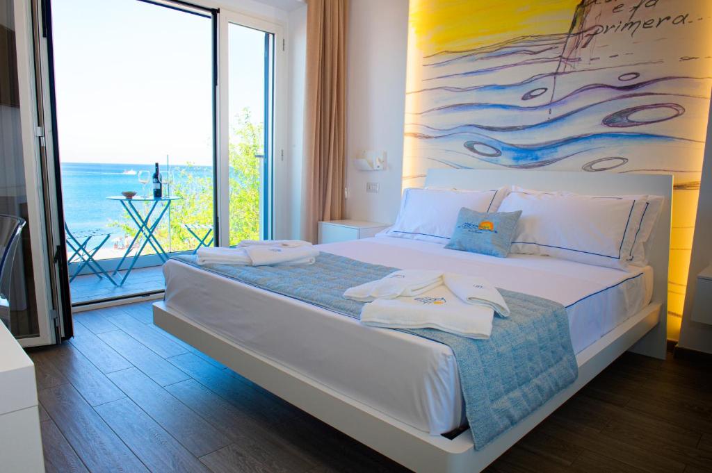 Postel nebo postele na pokoji v ubytování Mbaccimari B&B