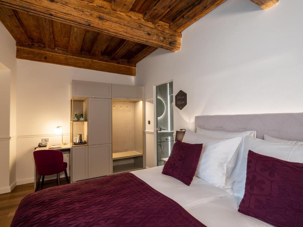 Postel nebo postele na pokoji v ubytování Hotel Heritage
