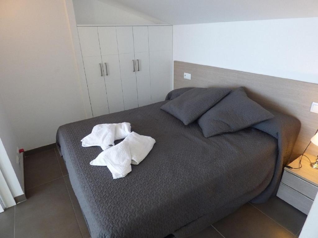 Postel nebo postele na pokoji v ubytování Voramar 33A - Joana Attic