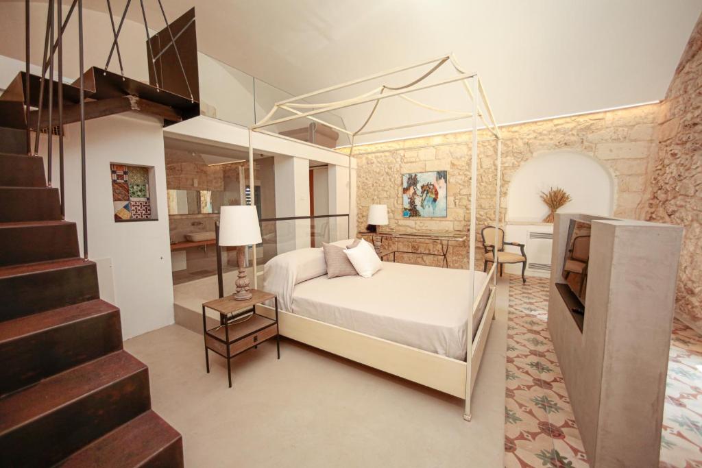 A bed or beds in a room at Masseria Francescani