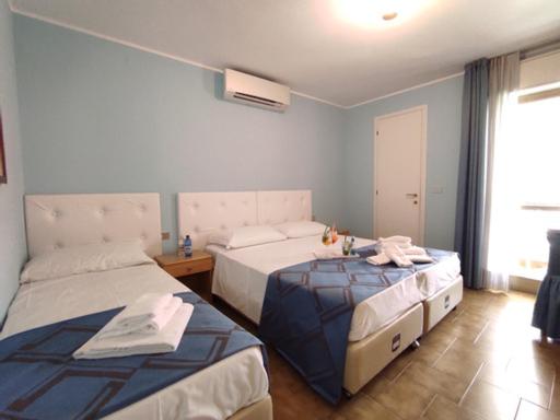 Postel nebo postele na pokoji v ubytování Villa Mirella-NUOVA GESTIONE
