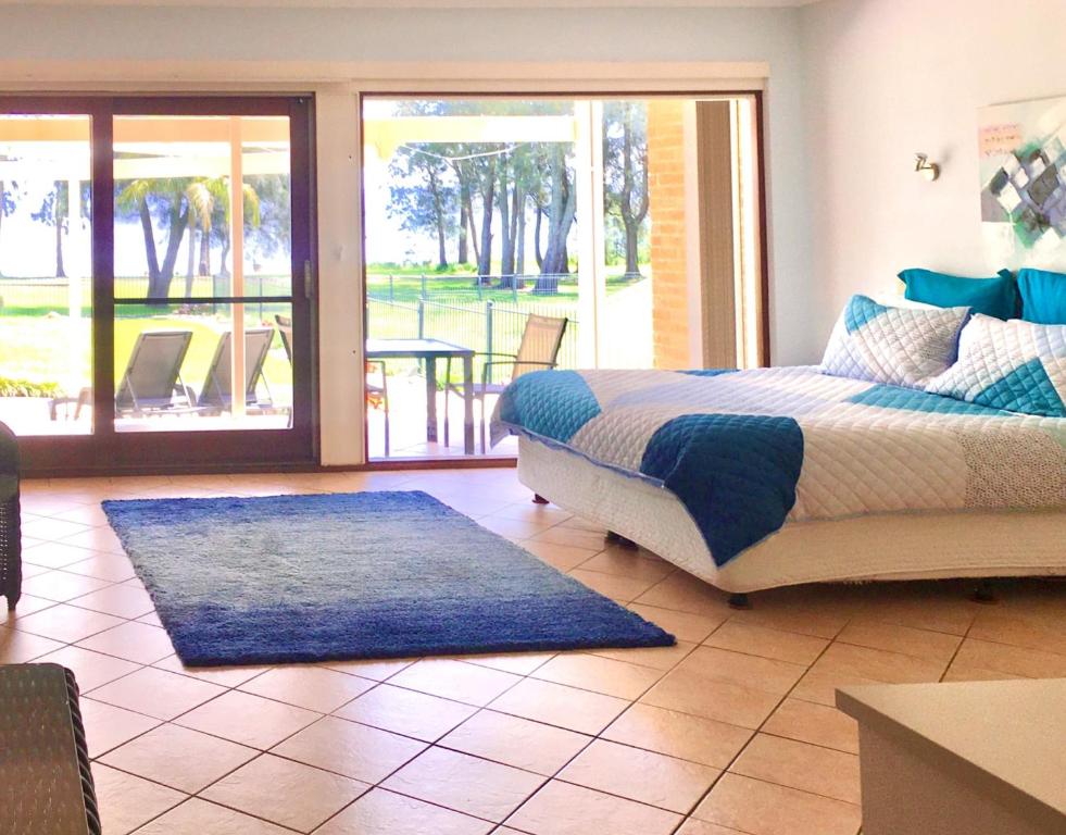 Postel nebo postele na pokoji v ubytování Paradise Beach Apartments