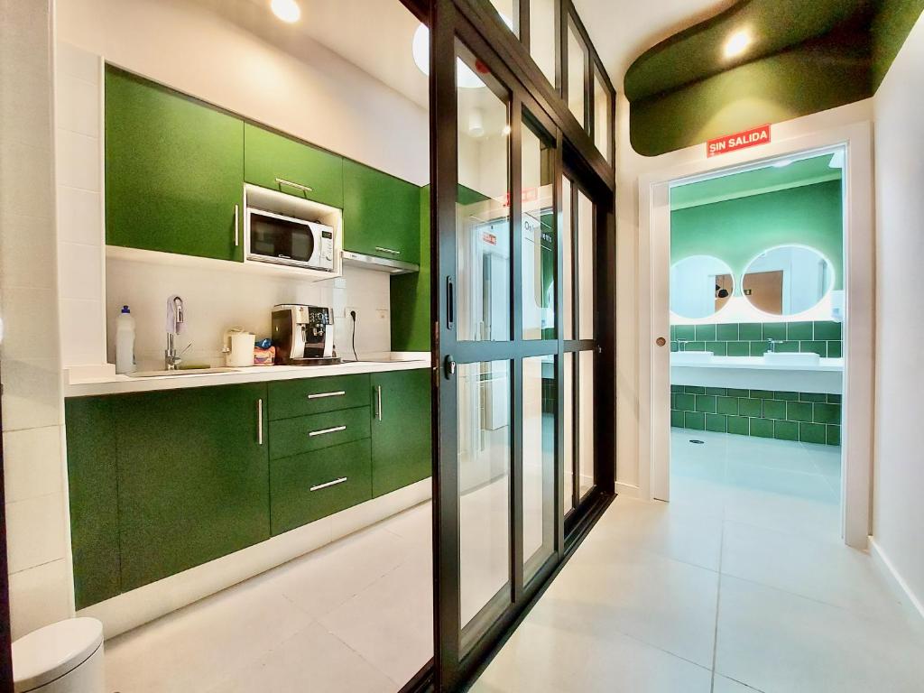 Kuchyň nebo kuchyňský kout v ubytování Atypicap Capsule Hostel