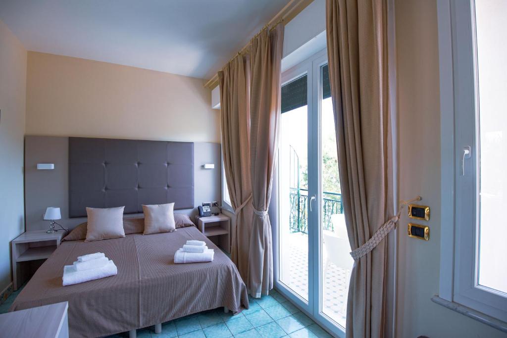 Postel nebo postele na pokoji v ubytování Villa degli Argentieri