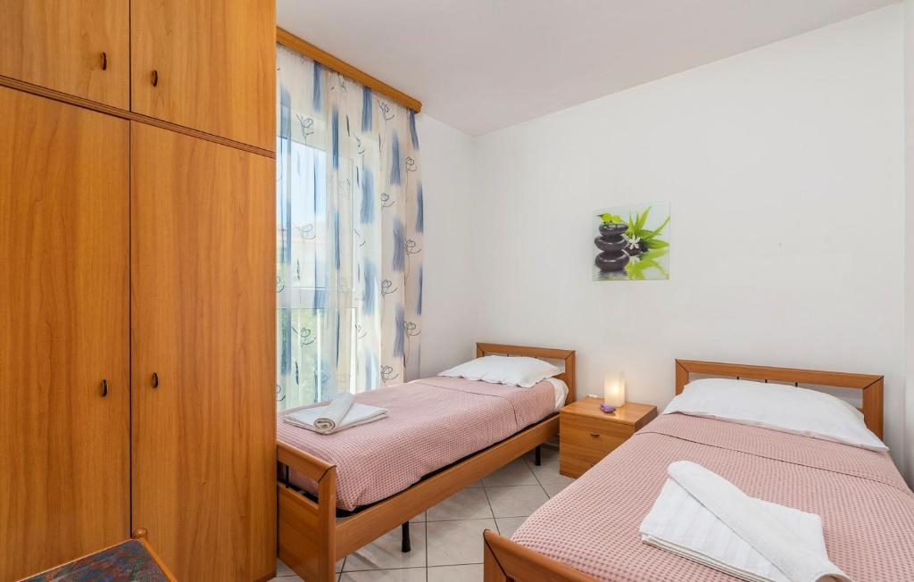Posteľ alebo postele v izbe v ubytovaní Apartment Batana