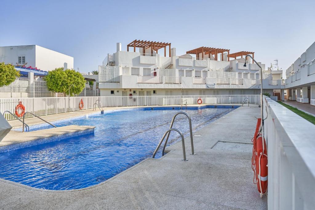 a swimming pool in front of a building at Pierre & Vacances Mojácar Playa in Mojácar