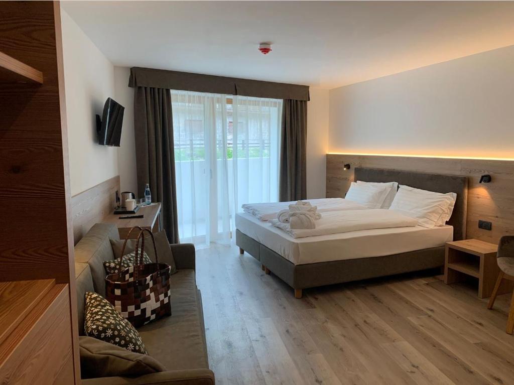 Postel nebo postele na pokoji v ubytování Hotel Miravalle
