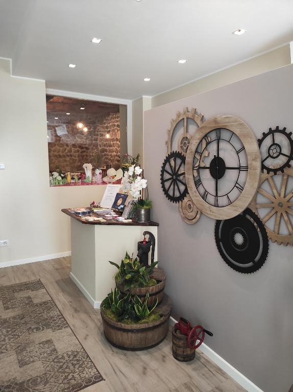 a store with clocks on the wall and a counter at Le vigne sull’Adda in Bottanuco