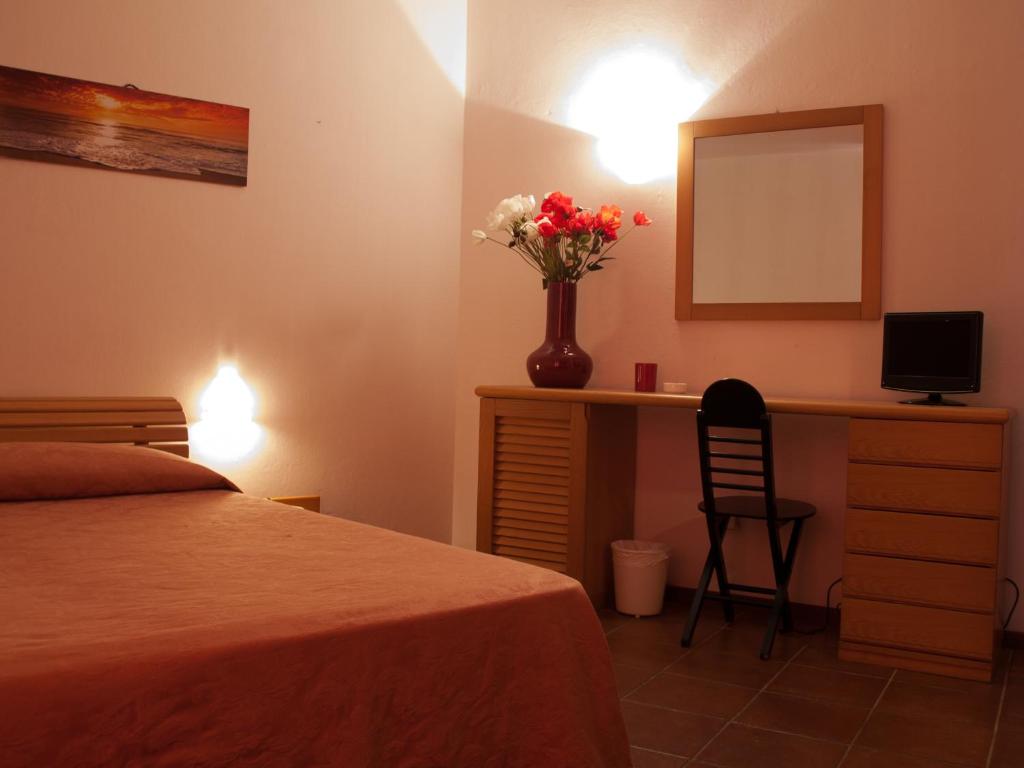 Postel nebo postele na pokoji v ubytování Hotel Garibaldi