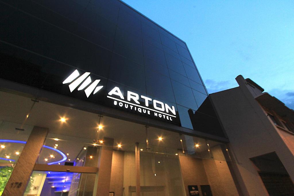 a building with a sign on the side of it at Arton Boutique Hotel in Singapore