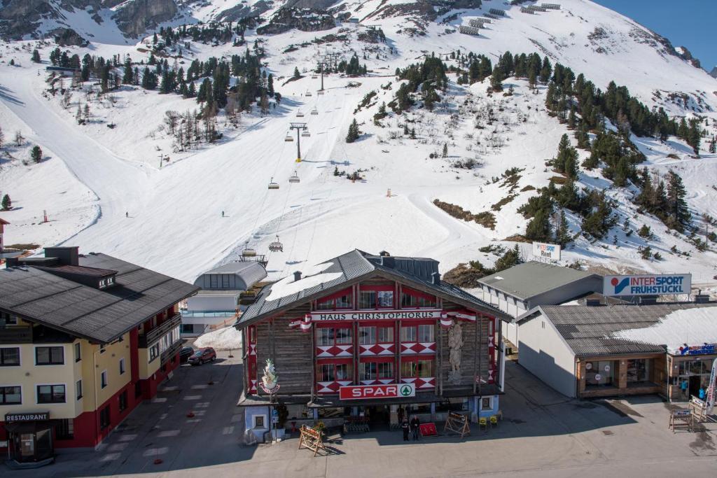 an aerial view of a ski resort with a snow covered mountain at Appartementhaus Christophorus in Obertauern