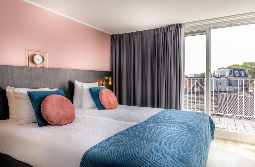 Postel nebo postele na pokoji v ubytování B&B Duinhuys