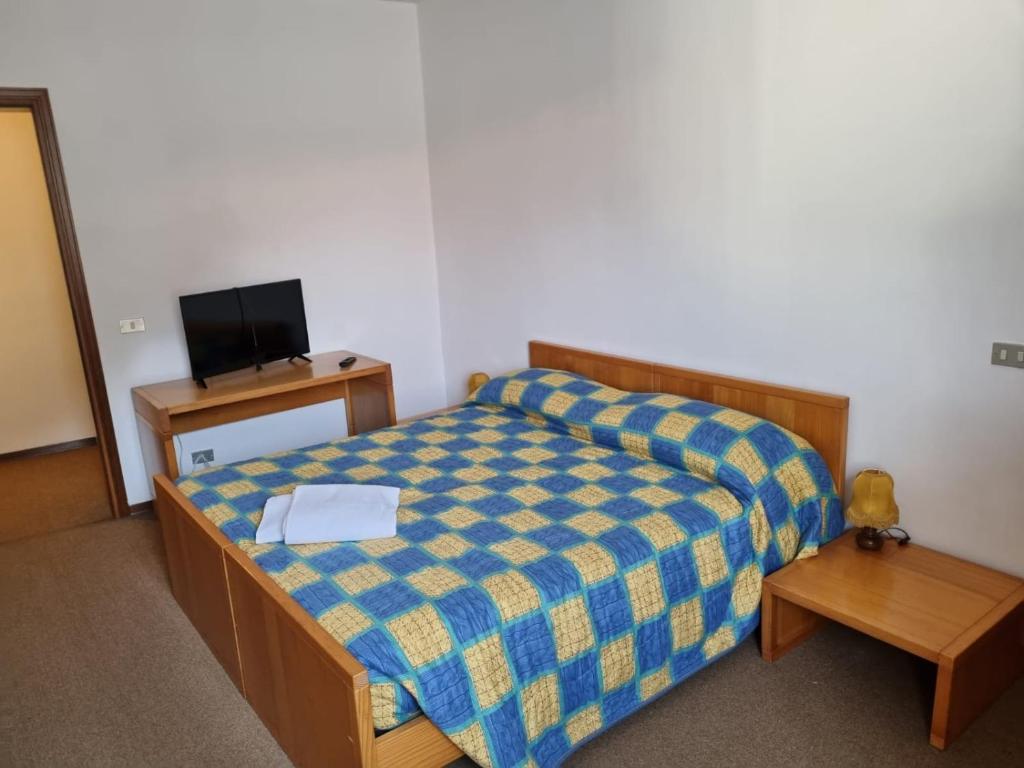 Postel nebo postele na pokoji v ubytování Albergo Spina