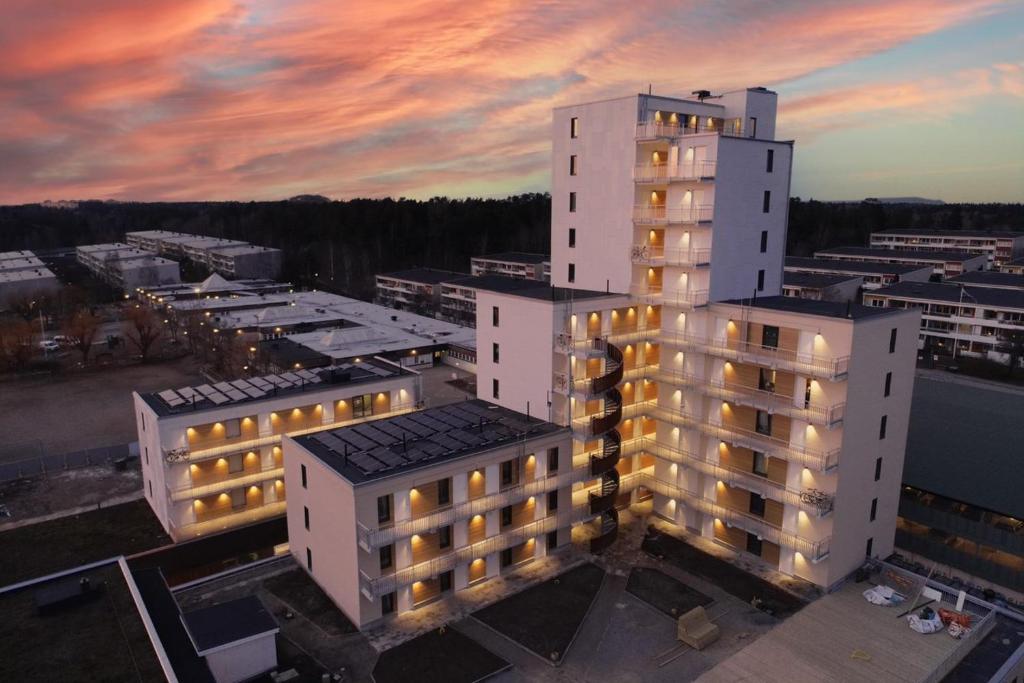 an overhead view of a building with lights on at Continental Apartment Hotel Sollentuna in Sollentuna