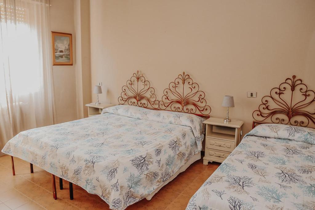 Postel nebo postele na pokoji v ubytování Lampada di Aladino