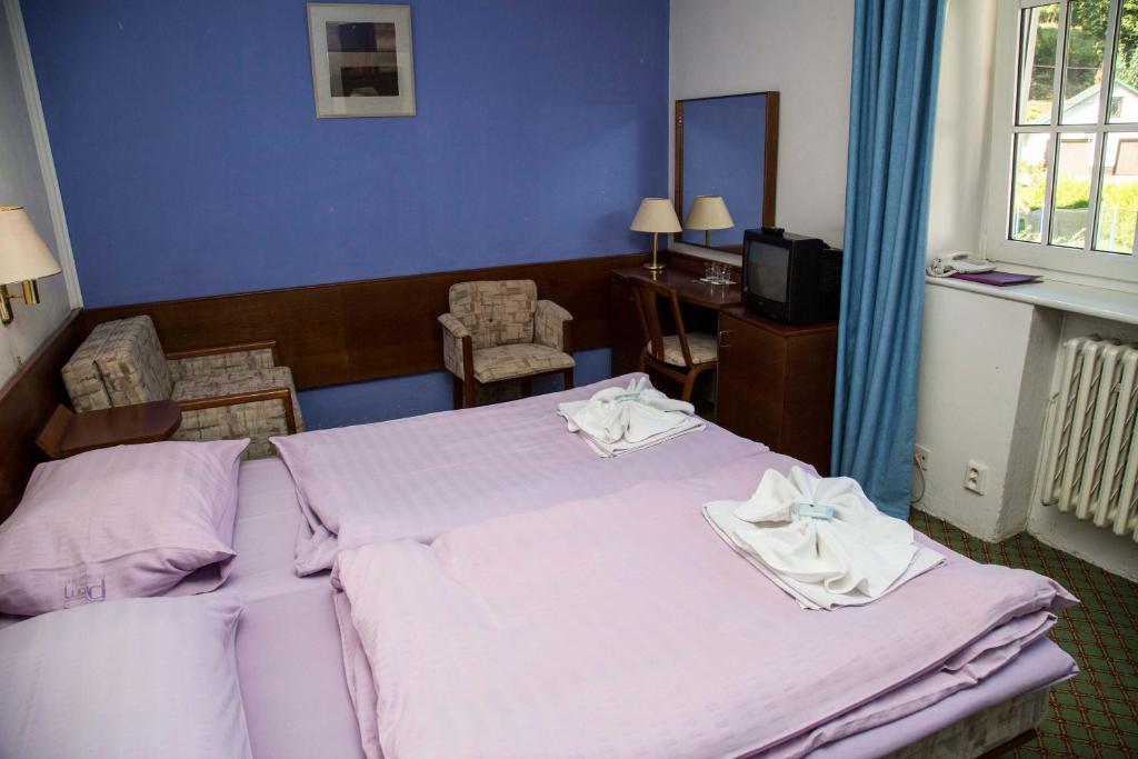 Postel nebo postele na pokoji v ubytování Hotel Prom