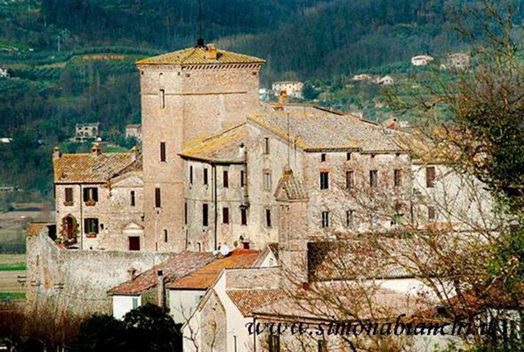 a large building with a tower on top of it at B&B Al Castello in Fabro