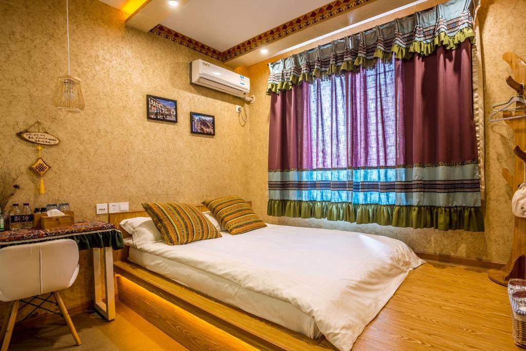 Postel nebo postele na pokoji v ubytování Hangzhou Citynest Music B&B