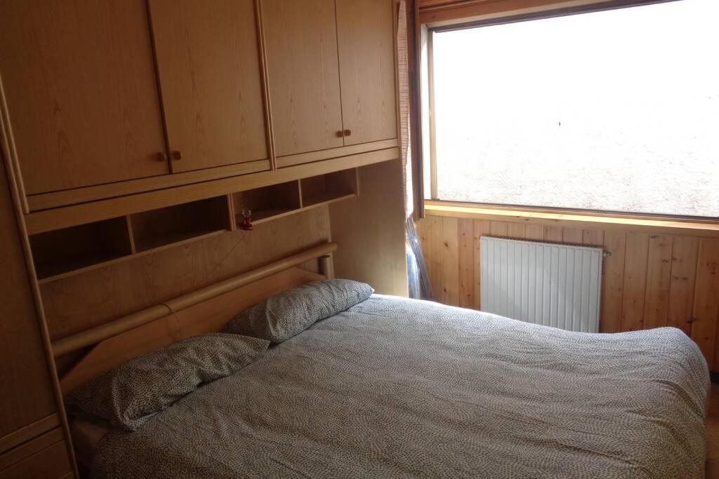 Postel nebo postele na pokoji v ubytování Intero appartamento in stile montagna