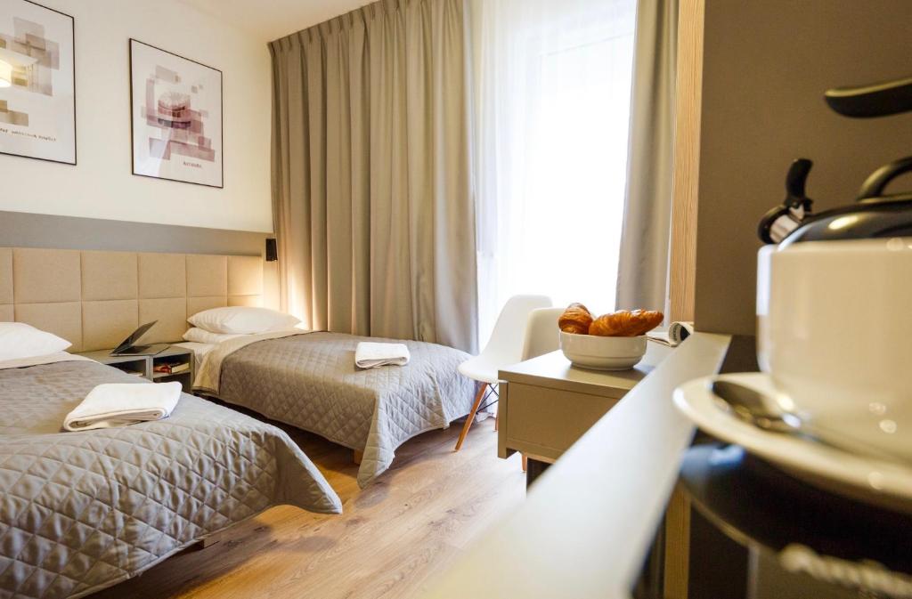 Posteľ alebo postele v izbe v ubytovaní Wolska Residence I