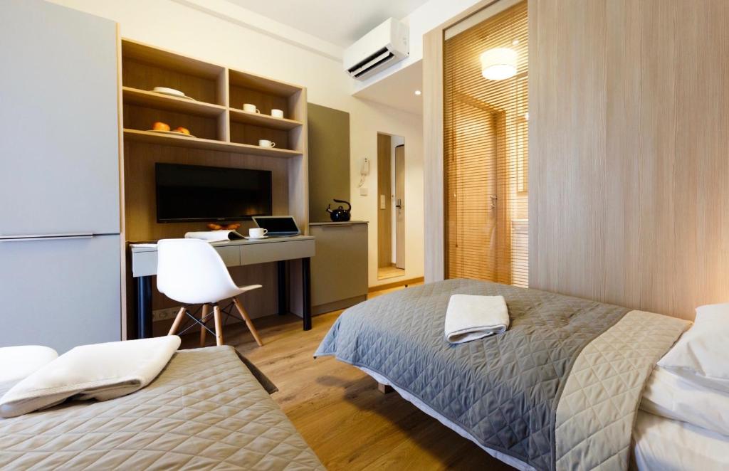 Posteľ alebo postele v izbe v ubytovaní Wolska Residence I