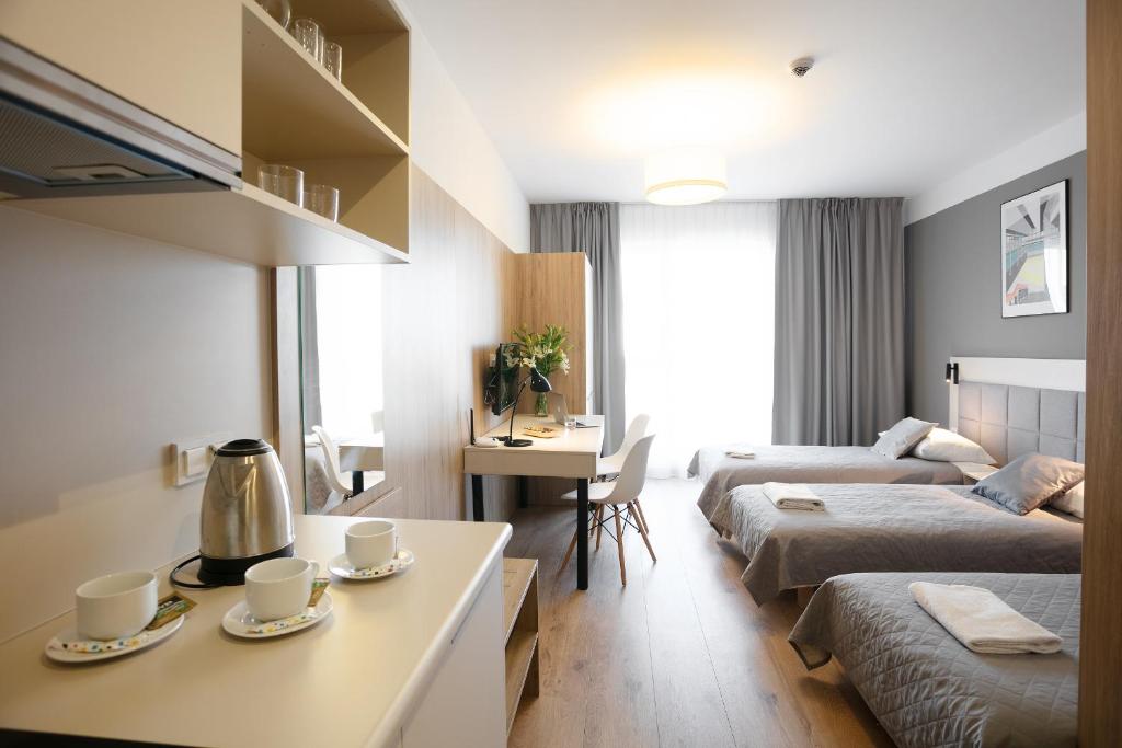 Posteľ alebo postele v izbe v ubytovaní Wolska Residence I
