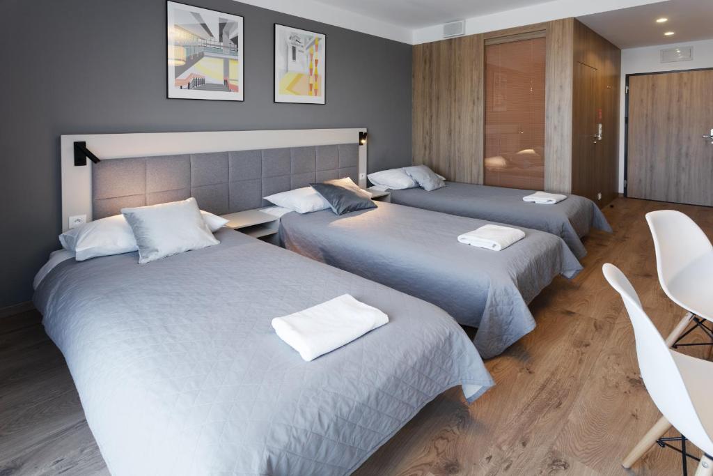 Posteľ alebo postele v izbe v ubytovaní Wolska Residence I