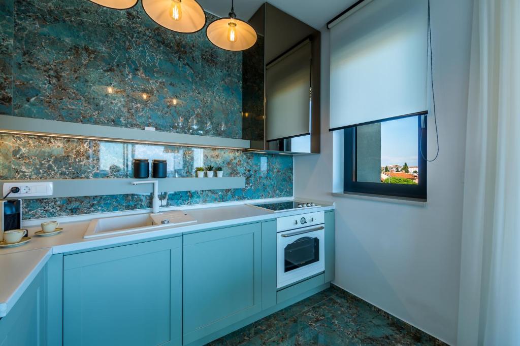 Kuchyň nebo kuchyňský kout v ubytování Rocca Riviera Umag Luxury Apartments