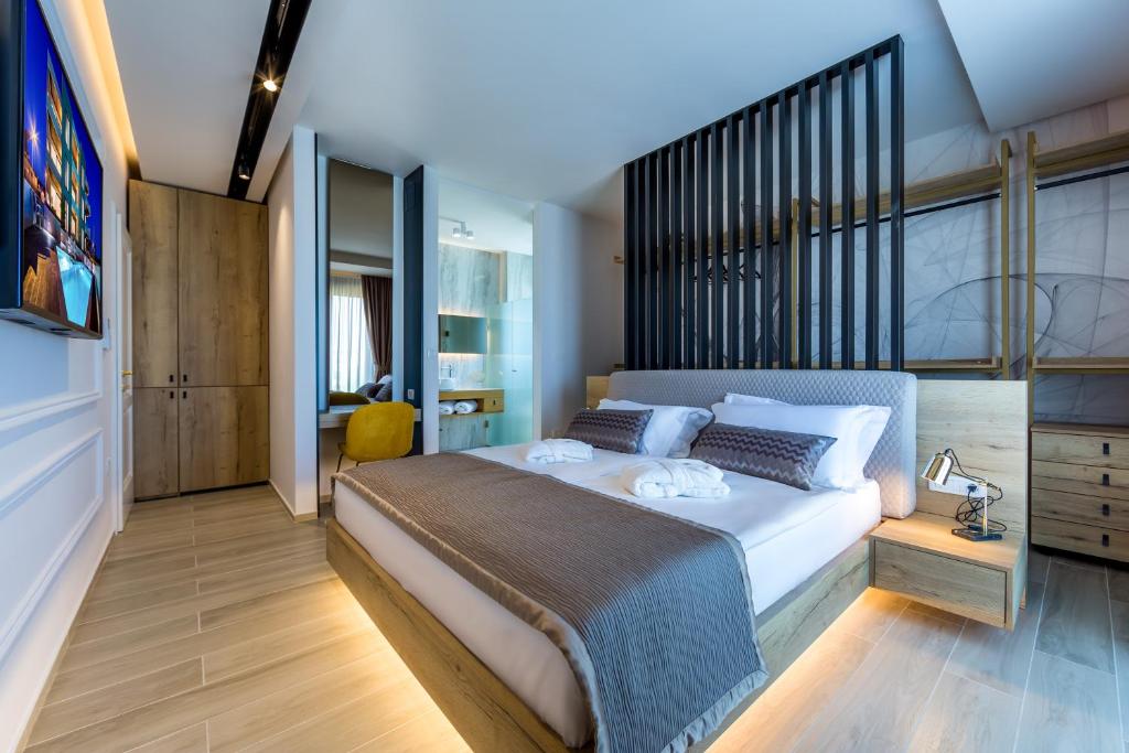 Postel nebo postele na pokoji v ubytování Rocca Riviera Umag Luxury Apartments