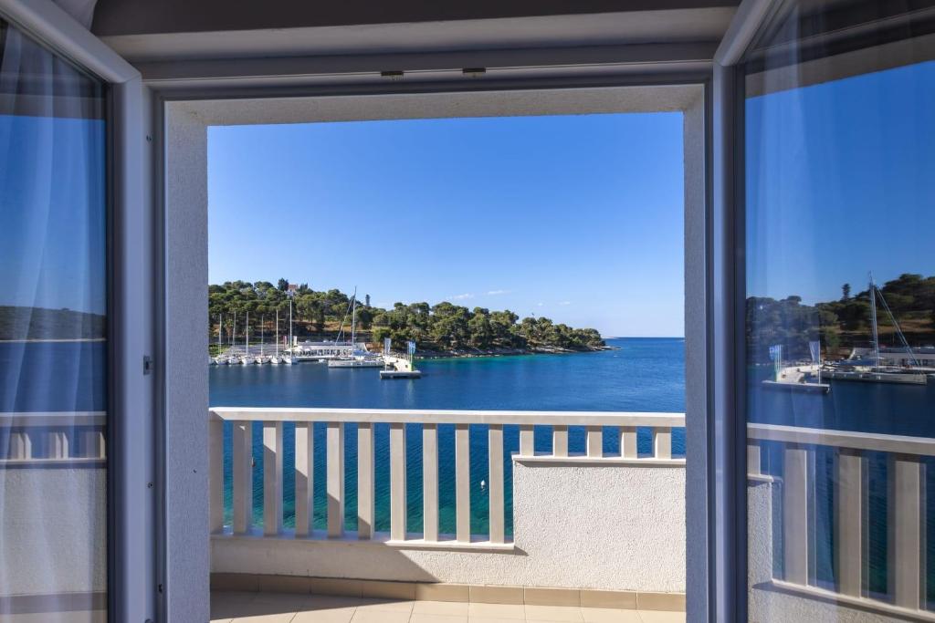 a view of the water from a balcony at Balkun in Maslinica