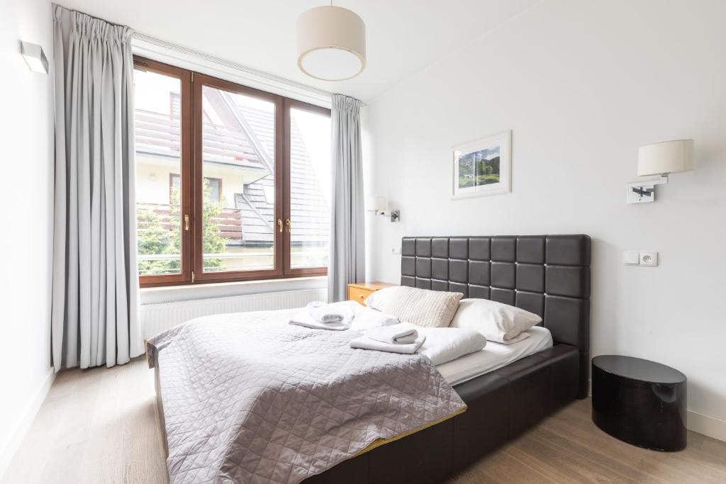 Posteľ alebo postele v izbe v ubytovaní Apartamenty Oaza Deluxe Zakopane