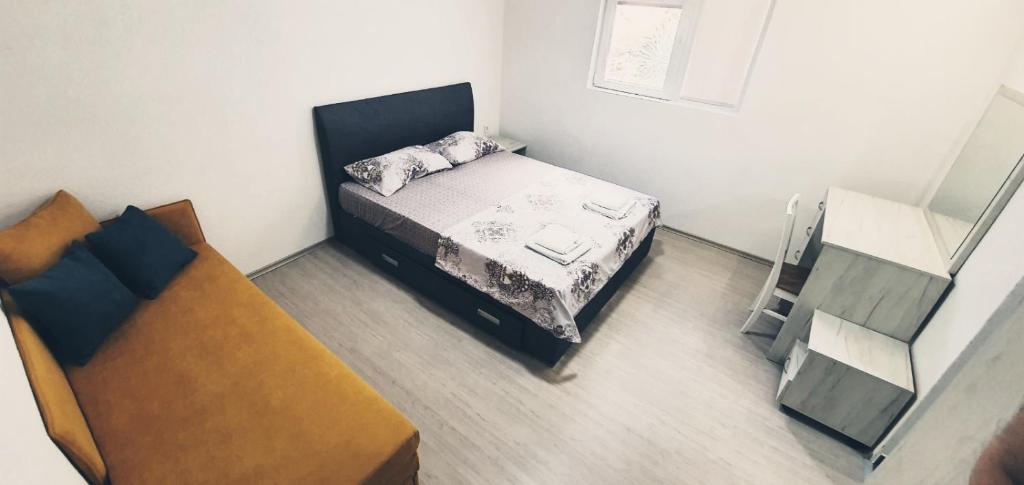 Postel nebo postele na pokoji v ubytování Apartmani Kaldrma
