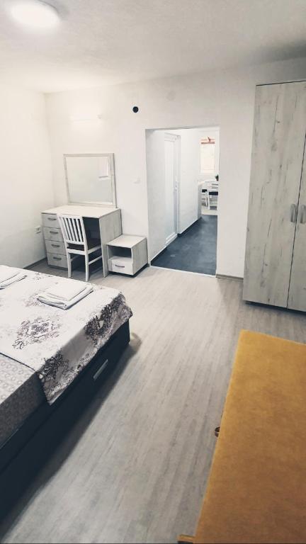 Postel nebo postele na pokoji v ubytování Apartmani Kaldrma