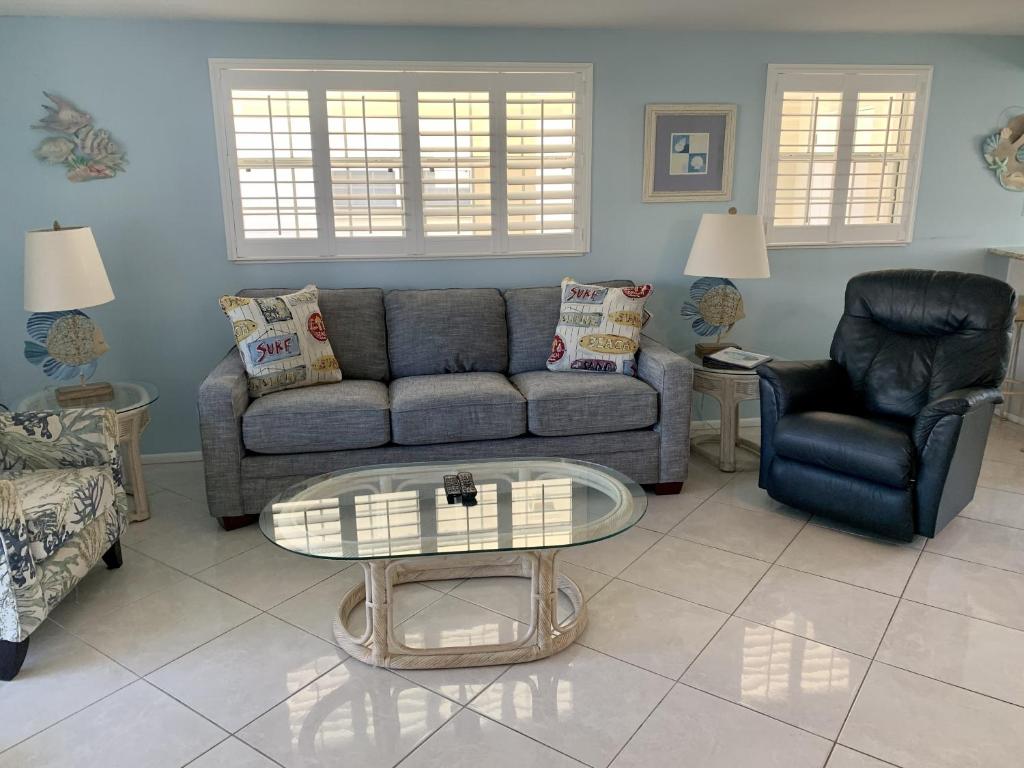 a living room with a couch and a table at Island House Beach Resort 18 in Siesta Key