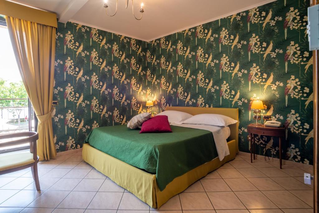 Postel nebo postele na pokoji v ubytování Locanda Da Otello