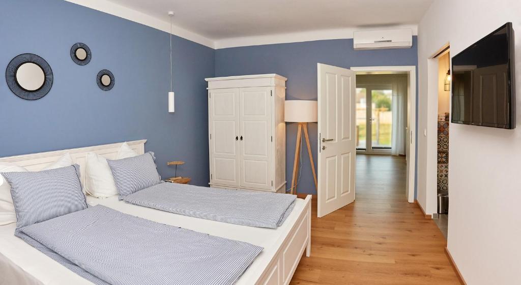 Postel nebo postele na pokoji v ubytování Logis 11 Apartments
