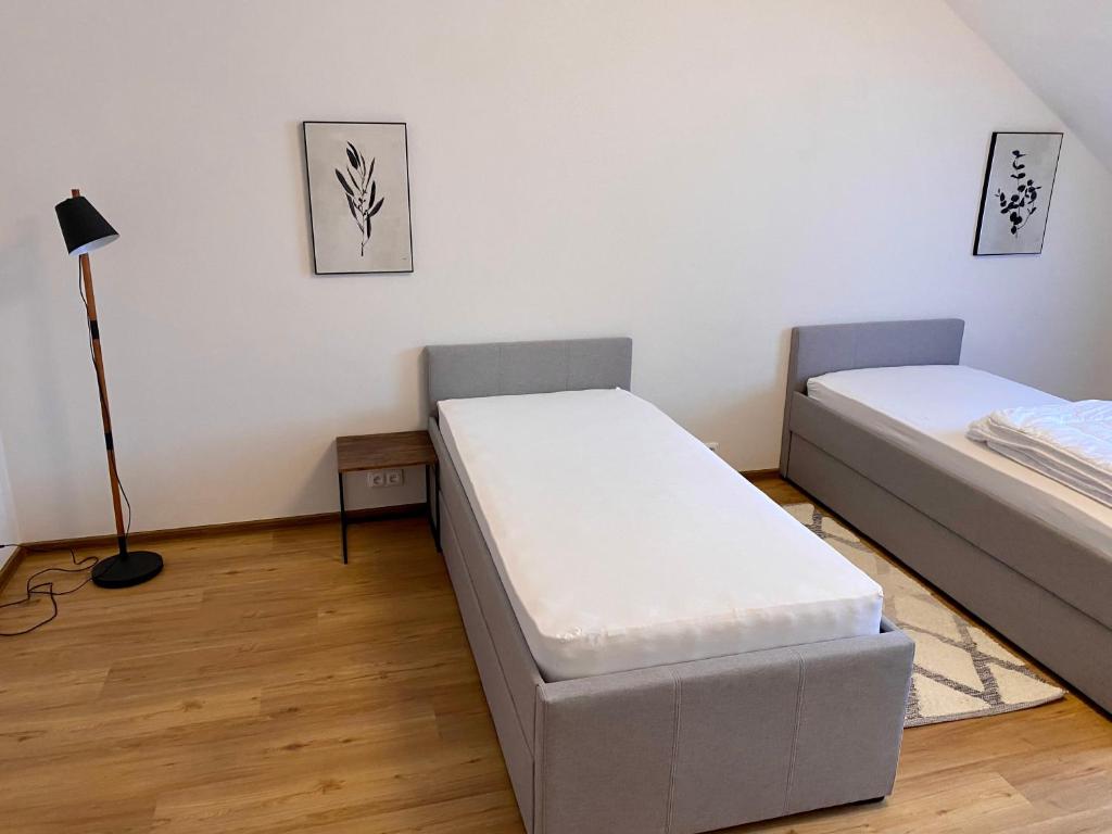 Posteľ alebo postele v izbe v ubytovaní Dobré časy Apartment