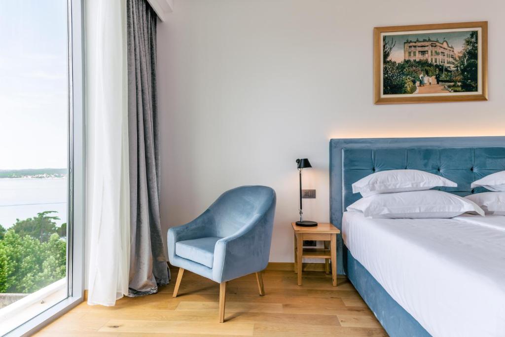 Postel nebo postele na pokoji v ubytování Hotel Miramare