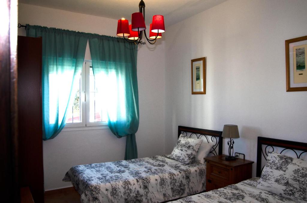 Postel nebo postele na pokoji v ubytování Zapata Home