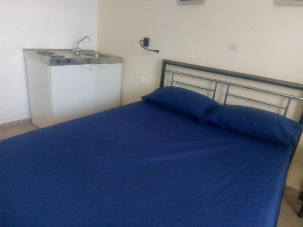 Postel nebo postele na pokoji v ubytování Balcony to Aegeon 3