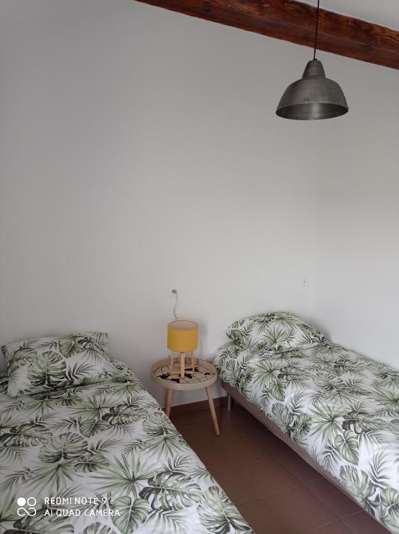 Postel nebo postele na pokoji v ubytování ferme de fenivou