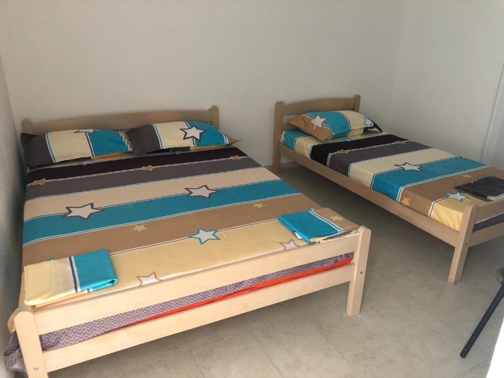 Postel nebo postele na pokoji v ubytování Apartments Beho