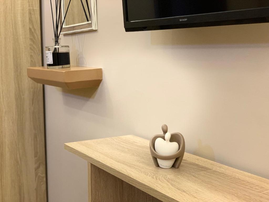 Televízia a/alebo spoločenská miestnosť v ubytovaní Emyteo Apartment