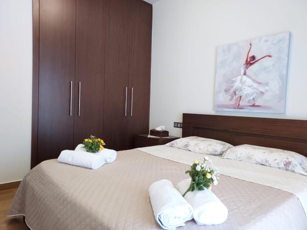 a bedroom with two beds with white towels on them at Luxury Summer Escape in Rhodes in Rhodes Town