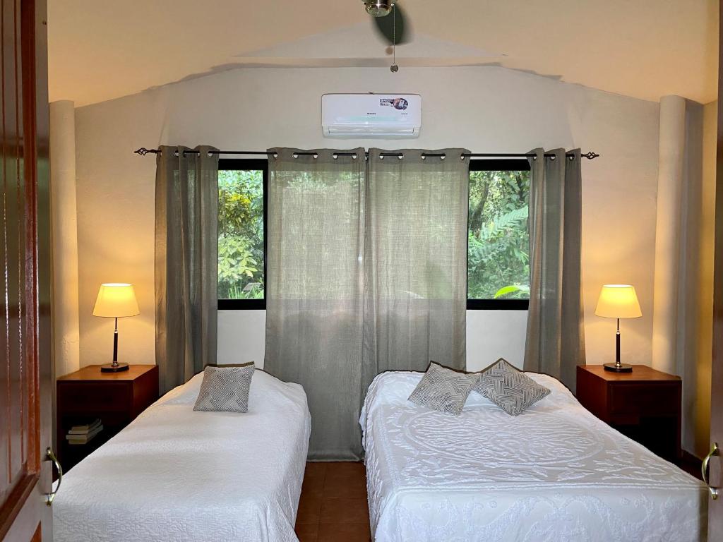 Postel nebo postele na pokoji v ubytování Cabanas Rio Encantado