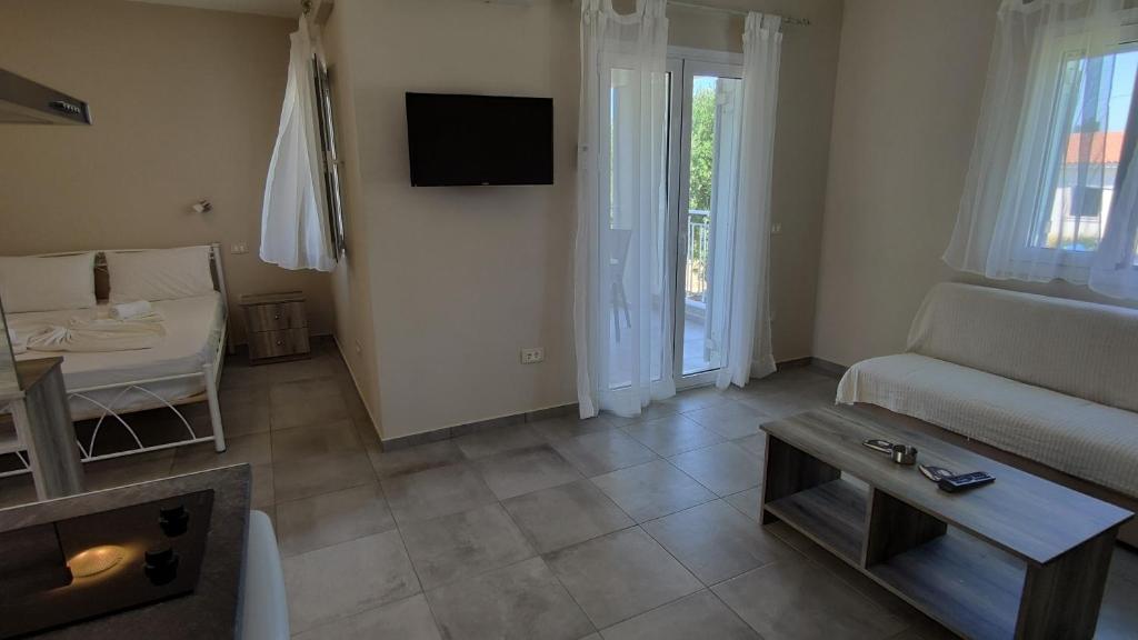 TV a/nebo společenská místnost v ubytování Casa De Rosa Apartments & Studios