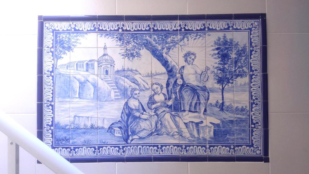 a tapestry hanging on a wall in a bathroom at Casa em Botafogo (Rio de Janeiro) in Rio de Janeiro