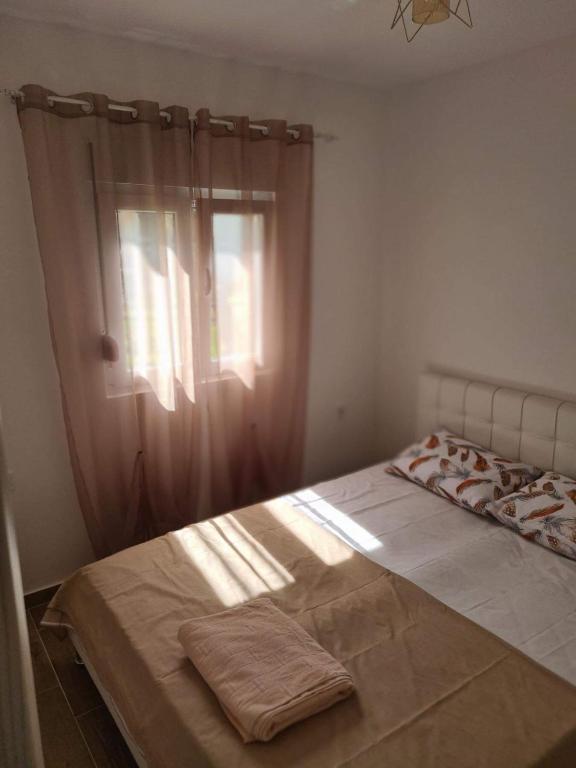 Postel nebo postele na pokoji v ubytování Apartmani Vanja
