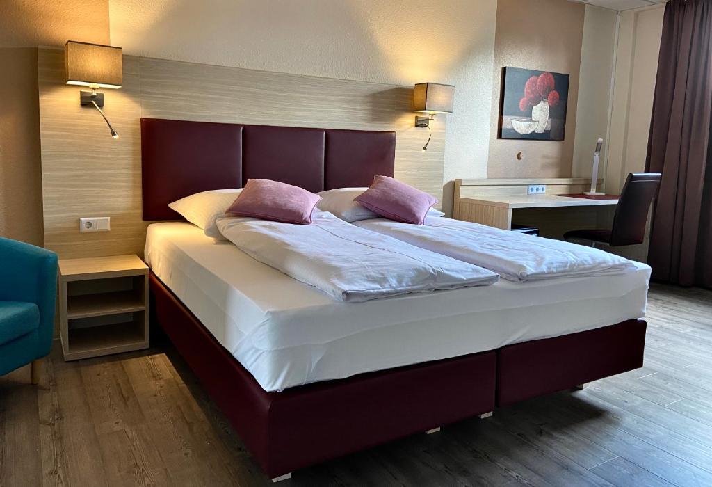 Postel nebo postele na pokoji v ubytování Residenz Hotel Neu Wulmstorf